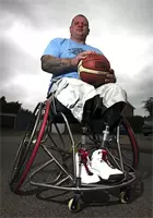 Steve in his basketball wheelchair with basketball